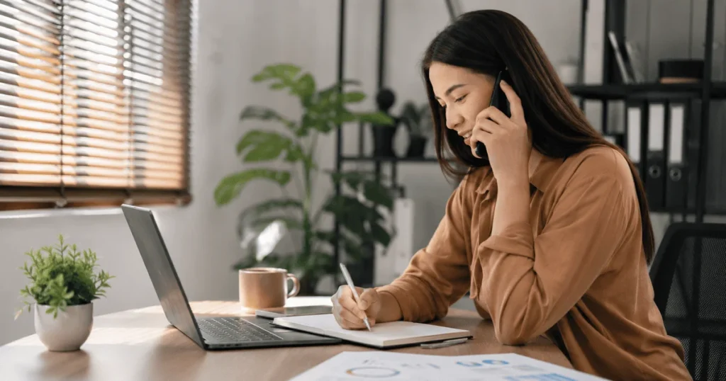 Sales Associate Jobs in Canada at UPS showing an Inside Sales Associate working remotely from a modern home office in Canada
